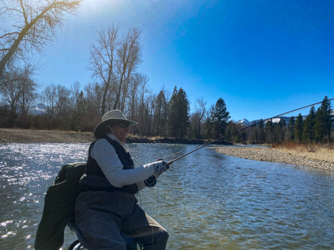 Nancy has a trout on the line on the Bitterroot