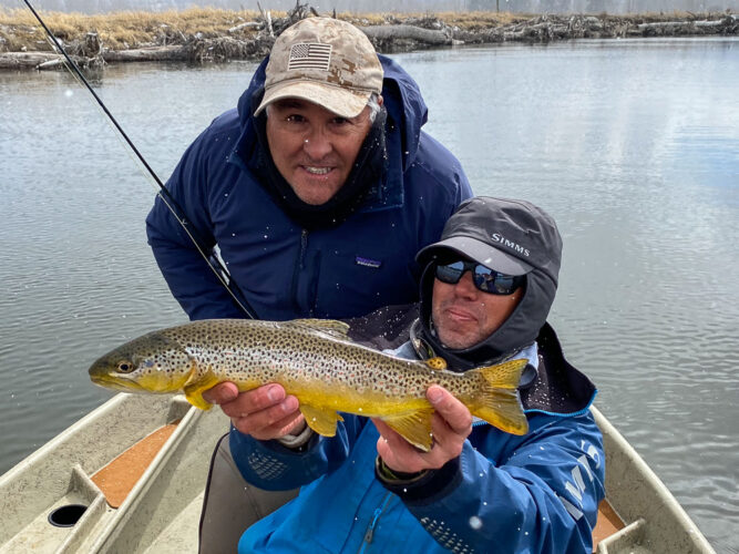 Art smiling through the shivers with a nice brown trout from the Bitterroot