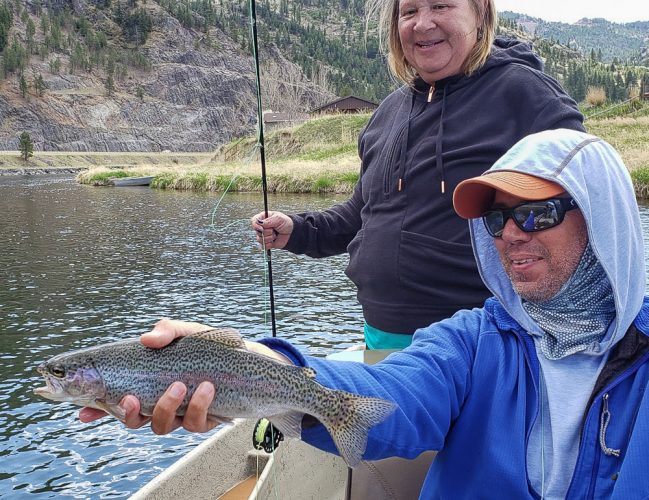 Jo Jo with a spunky rainbow trout