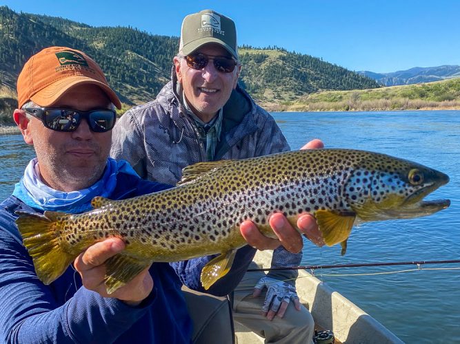 Jim with a big brown trout in the morning