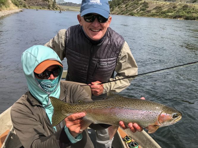 Hunter with a flawless specimen - Big Rainbow Trout