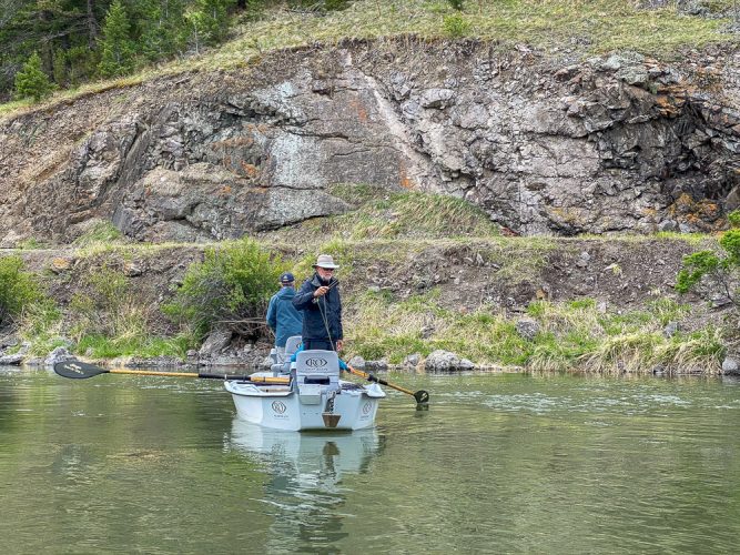 Lev hooked up in a side channel - Big Rainbow Trout