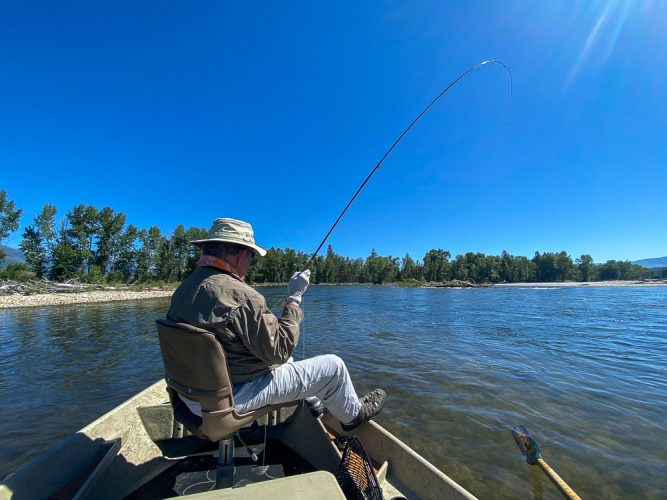 Jim hooked up on a blue bird day - Trout Fishing Montana