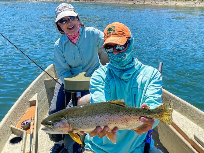 Penny with a big fish at the dam