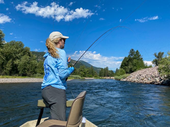 Constance battling a feisty rainbow - Clark Fork Fly Fishing July