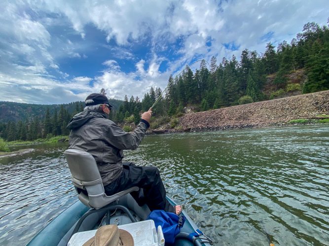 Jim hooked up to a nice trout - Clarkfork August Fishing