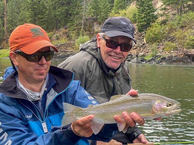 Jim with a solid cuttbow in the morning - Clarkfork August Fishing