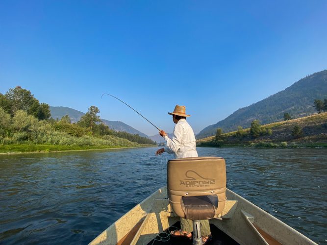 Carolyn tight to a feisty trout in the morning.- Montana Fly Fishing