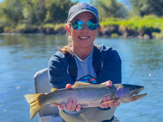 Erin with a big cuttbow after the hopper - Montana Fall Fishing Fun