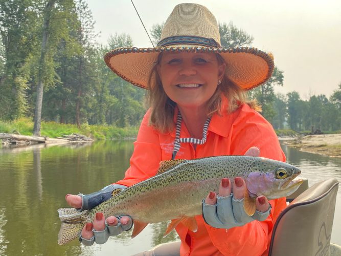 Sandra with a hot rainbow - Missoula August Fishing