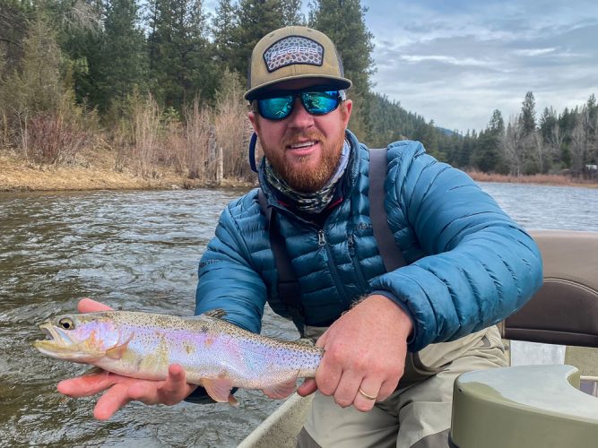 Bradley with a bright rainbow in the morning- Flyfishing Montana 2022