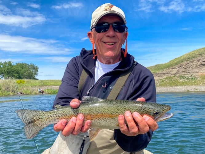 Tim with a great rainbow at the end of the day- Great Fishing on the Mo