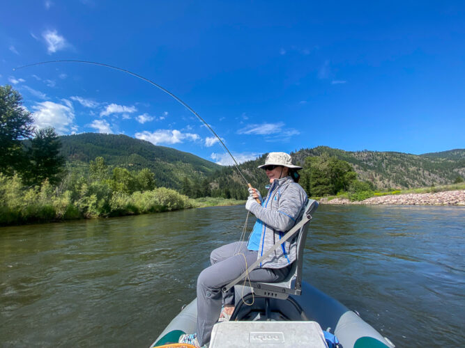 Laura hooked up at the mouth of Rock Creek - Full Moon Fishing in Montana 