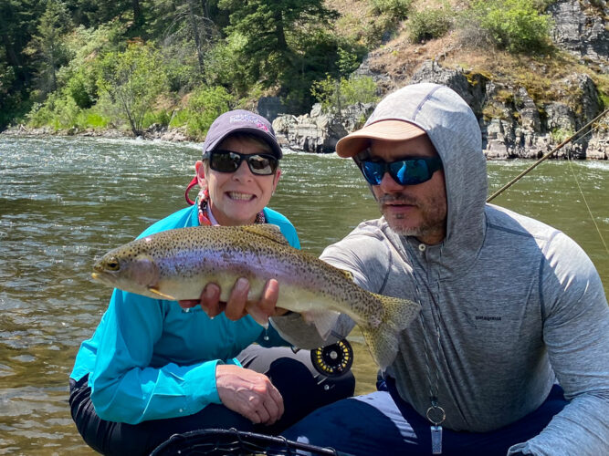 Sheila with a nice rainbow at the lunch spot - Full Moon Fishing in Montana 