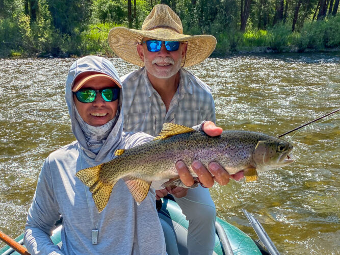 Jeff with a hot dry fly eating rainbow in the morning - Full Moon Fishing in Montana 