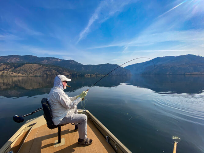 Bob hooked up first thing in the morning on the lake - Spruce Moth Hatch Fishing