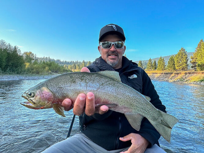 Christopher with a fat cutthroat on a streamer - Early Morning Fly Fishing