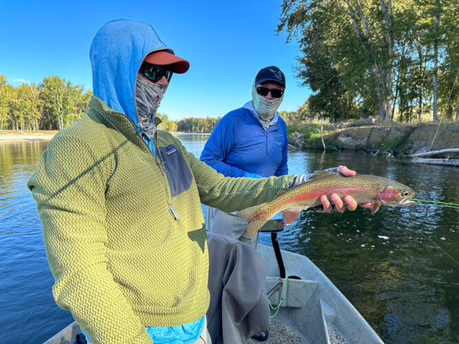 Jim with a colorful rainbow on the hopper - August Fly Fishing