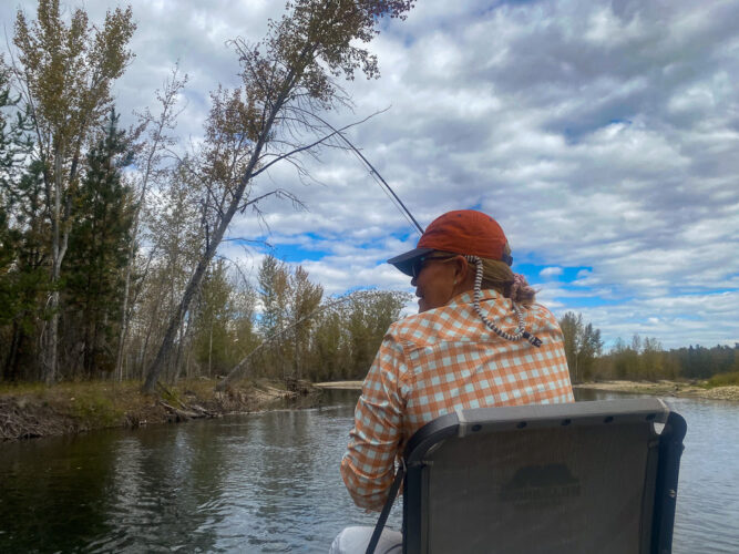 Sandra hooked up in the clouds - September Montana Fishing report
