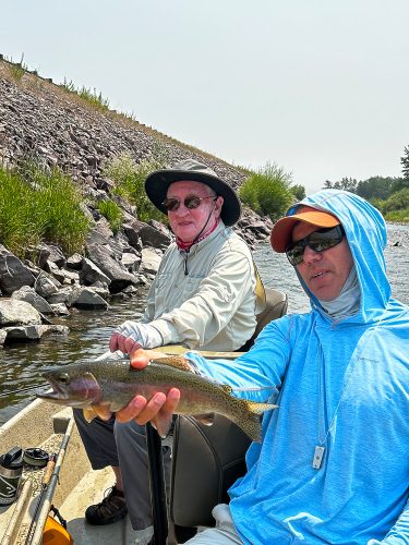 Stan with a quality rainbow - Montana Trout Fishing July Report