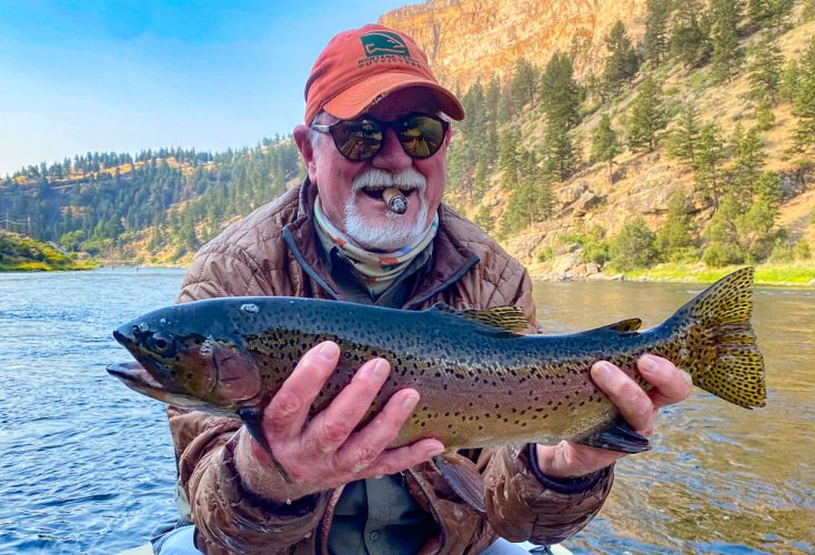 Bob started the trip off with a big bow in fast water - Best Montana Fishing