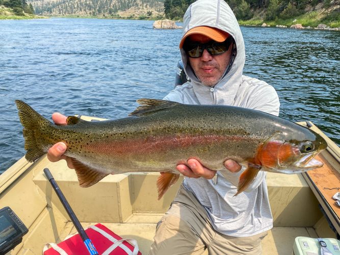 Bob with an absolute beast of a rainbow.  We didn't measure, but I am confident this fish was in the 25" range - Best Montana Fishing