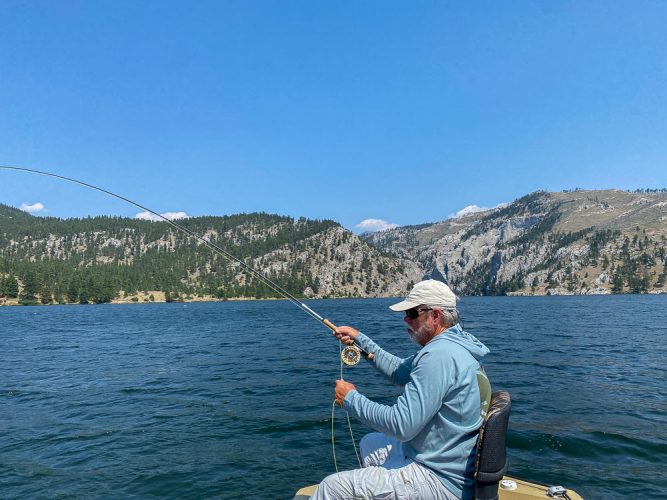 Tight to another one in the lake with the Gates of the Mountains behind - Montana Trout Fishing July Report