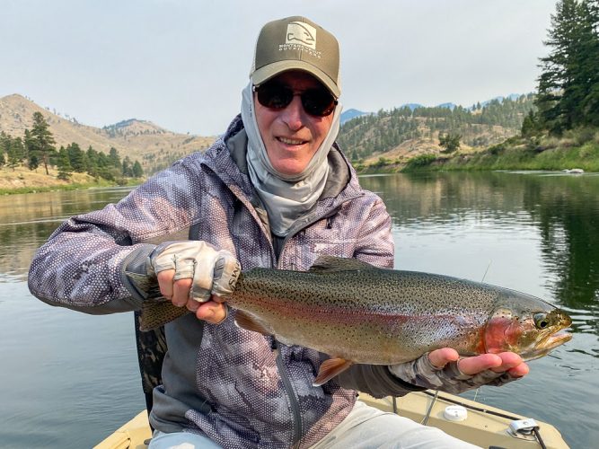 Jim with a colorful rainbow - August Fishing