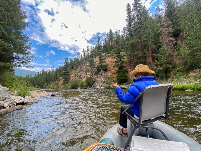 Martha doing what she does best, bringing another dry fly fish to the net - August Fishing