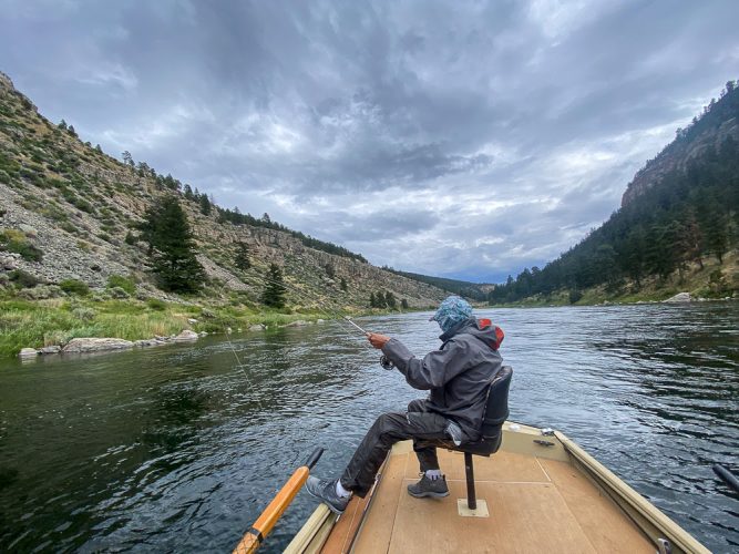 Jim putting a big bend on the rod on the upper river - Fishing the Land of the Giants