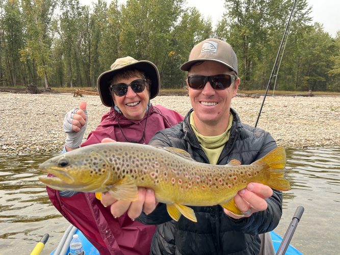 Long-time angler Kathy scored with a big dry fly brown with guide David - Fall Fishing the Land of the Giants