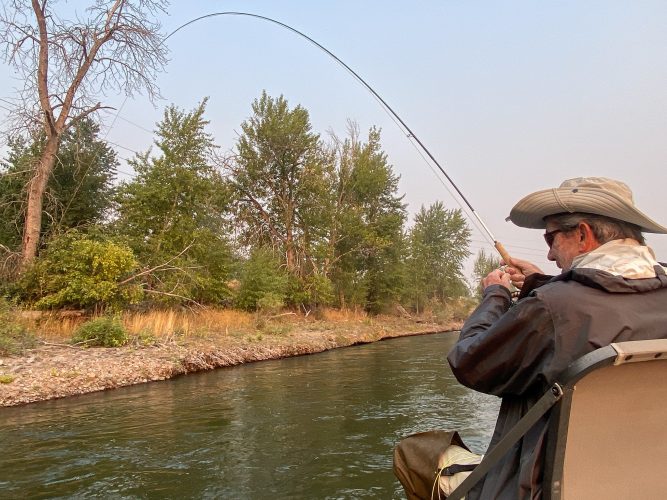 Dan hooked up to a hot rainbow - Fall Fishing in Montana