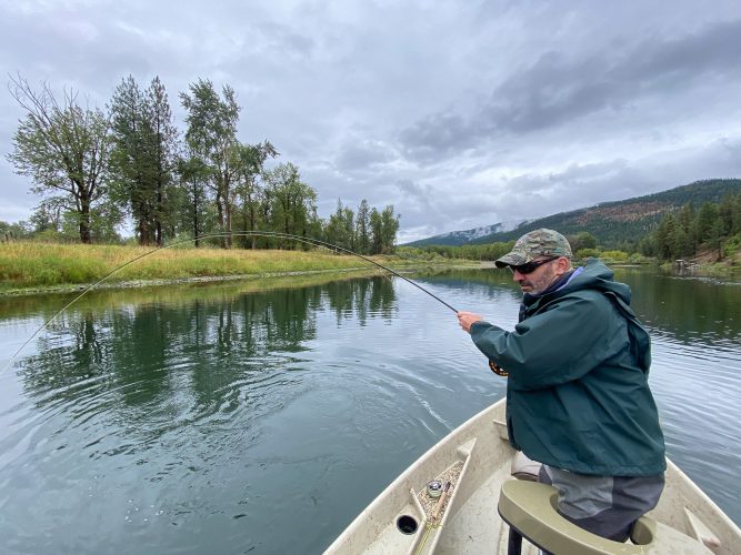 Gregg putting a big bend in the rod - Fall Fishing in Montana